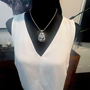 Sleeveless white v neck top